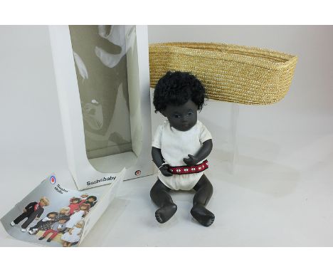 A Sasha 'Black Baby' doll, with brown curly hair and brown eyes, no. 509, in white cotton top and knickers, 29cm high, with m