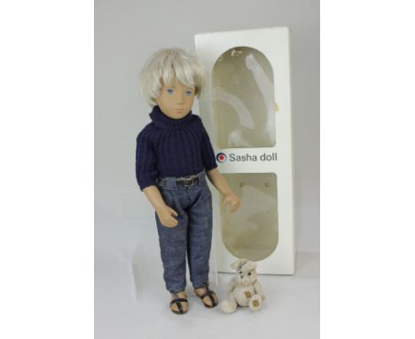 A Sasha 'Gregor' doll, with fair hair and blue eyes, no.4-305, dressed in blue polo neck, denim trousers and sandals, with to