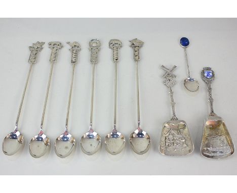 Two Dutch 900 silver sugar shovels, a Chilean with metal coffee spoon with blue hardstone finial, and a set of six white meta