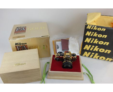 A Nikon FA limited edition Gold Camera to commemorate The Camera Grand Prix '84, gold plated with lizard leather embellishmen