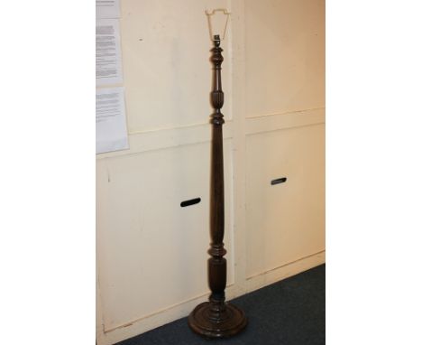 A turned wood standard lamp with reeded baluster stem on circular base, 157cm high