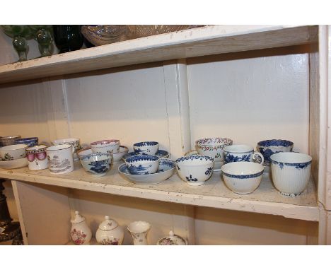 A collection of 19th century porcelain tea bowls, teacups and saucers, including English, European and Chinese examples, with