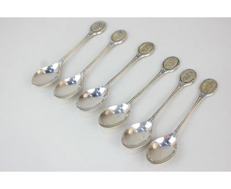 A matched part set of six Elizabeth II silver collector's spoons, maker John Pinches, Sheffield, with a different embossed fl