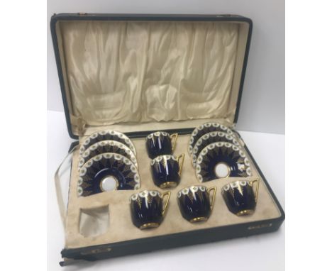 A cased set of Royal Worcester jewelled ware coffee/tea cups and saucers (set of six - one cup missing) together with a set o