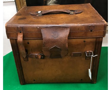 A square leather hat box/vanity case, the hinged lid opening to reveal fitted interior with space for a hat bearing label ins