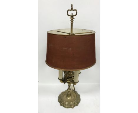 A brass table lamp in the Middle Eastern style, the central column set with hanging accoutrements and four branches, raised o