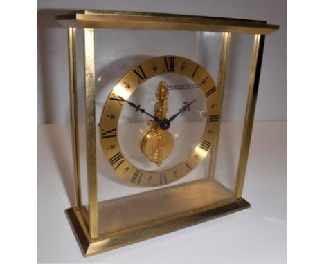 A Jaeger-LeCoultre four glass lacquered brass framed mantel clock with sixteen jewel movement, the chapter ring with Roman nu