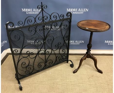 An Edwardian mahogany inlaid card table, the rising top revealing a baise lined interior raised on square tapering legs to pa