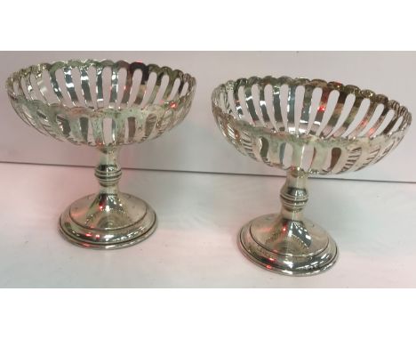 A pair of Edwardian silver pedestal dishes with pierced decoration raised on circular bases (by William Hutton &amp; Sons Ltd