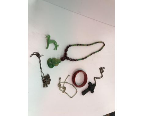 A collection of vintage jewellery to include a bakelite necklace in the jade and amber manner, a cinnabar bangle, various ear