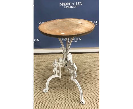 A Victorian white painted cast iron tripod table with dished circular beech top, the base with kite mark 44 cm diameter x 69 