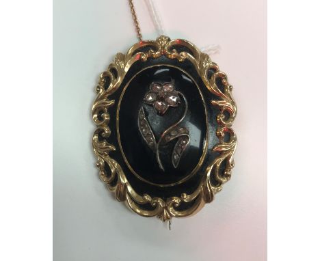 A 19th Century gold and diamond set mourning brooch the central panel with floral spray 5.5cm CONDITION REPORTS Total weight 