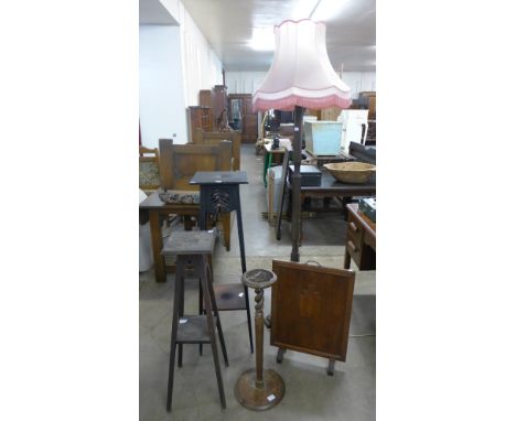 An oak standard lamp, two jardiniere stands, smokers stand and an oak firescreen