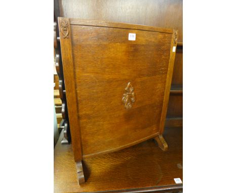 A 1930's oak firescreen