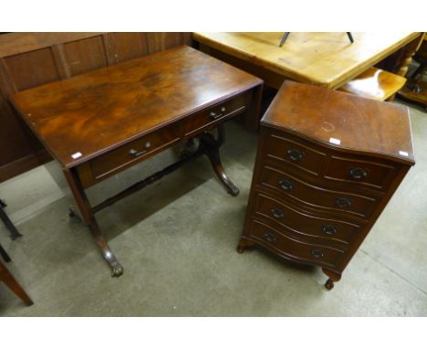 An inlaid mahogany sofa table and a mahogany serpentine chest of drawers