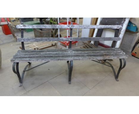 A wrought iron garden bench