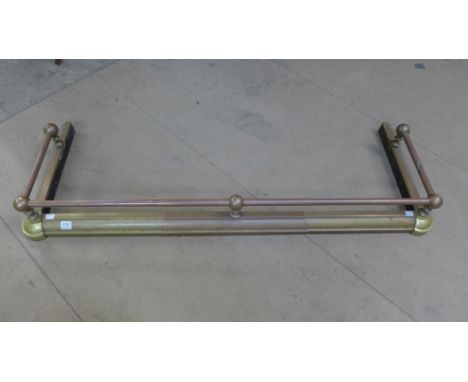 A Victorian adjustable brass fender