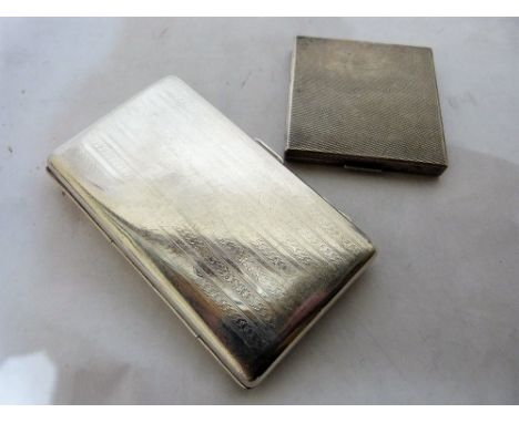 A silver cigar case and a silver engine turned cigarette case. 12ozs 15 dwts