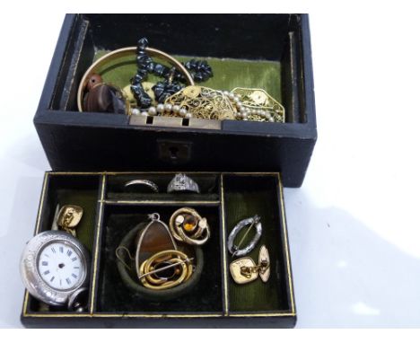 A leather jewellery box containing miscellaneous jewellery including a silver fob watch, amethyst brooch, hardstone pendant e