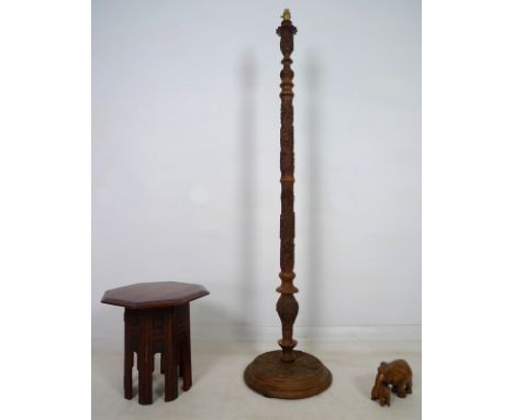 An Indian 19th century lacquered folding octagonal side table, 38.5 by 40cm, a profusely carved Indian standard lamp, 35 by 6