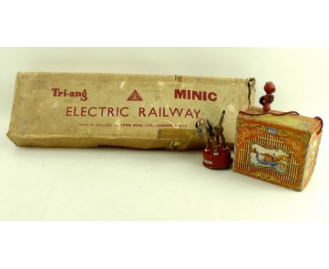 A Minic Triang Electric Railway, made by Lines Bros Ltd London SW19 with box, 17 by 60 by 7cm, a Selcol Organ Grinder, 13.5 b