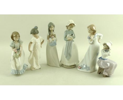 A group of Nao figurines, comprising a standing girl in a sweeping dress with butterfly, 23.5cm, a girl with vase of flowers,