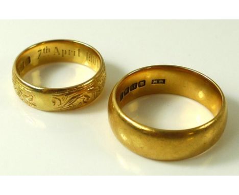 Two 18ct gold rings, one foliate engraved with 7th April 1904 inside, size M, the other a plain band, size Q/R, 14.9g total w