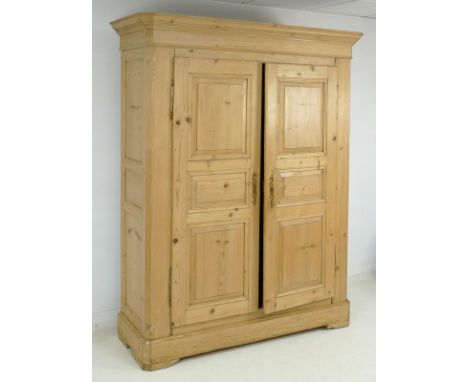 A French 19th century stripped pine wardrobe, with two panel doors, can be dismantled for ease of transport, 155 by 58 by 207