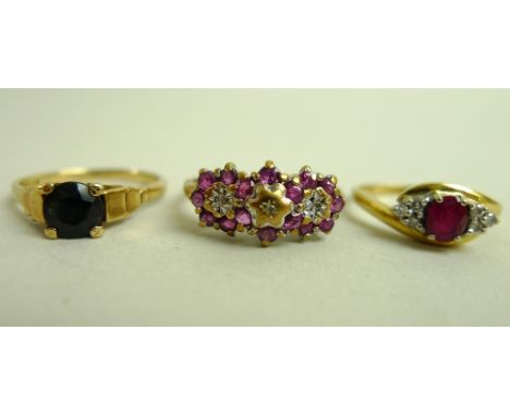 An 18ct gold, platinum, ruby and diamond dress ring, the central oval cut ruby flanked by two sets of three diamonds either s