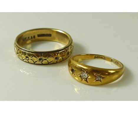 An 18ct gold gypsy ring, set with three diamonds, a/f one missing, size K/L, together with an 18ct gold wedding band engraved