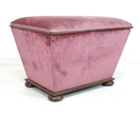 A Victorian rosewood lidded box of sarcophagus form, with moulded lower edge, upholstered in pink velvet, raised on four flat