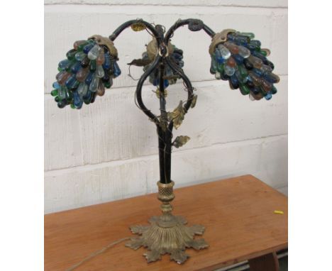 An early 20th century 'grape bunch' table lamp, three scrolled branches entwined with gilded wire, vine leaves and yellow gla