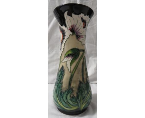 Moorcroft pottery four star members baluster vase, buff ground, black at neck and foot, tube lined decoration of white poppy 