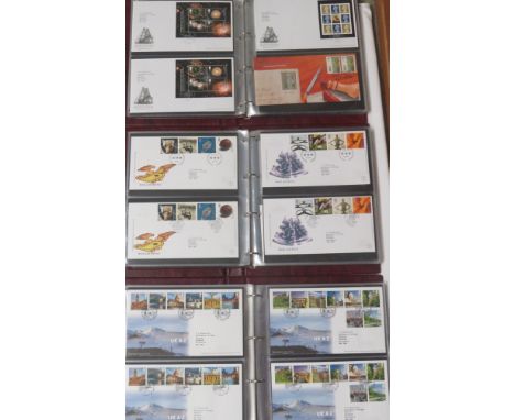 Seven Royal Mail First Day Covers maroon albums with fifty-eight covers 2000-2001, sixty-one covers 2002-2003, sixty-three co