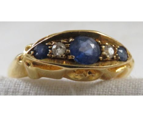 18-carat gold sapphire and diamond ring, the central largest sapphire (round cut diameter 4mm) set in a line between two diam