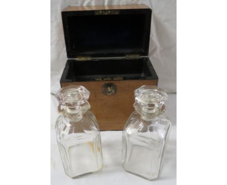A mid 19th century decanter box with two cut glass decanters, light wood with ebonised edging, brass escutcheon, lined with l