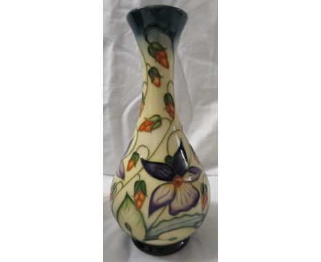 Moorcroft pottery one star members vase of bottle shape, cream ground, green at neck and foot, tube lined decoration of purpl