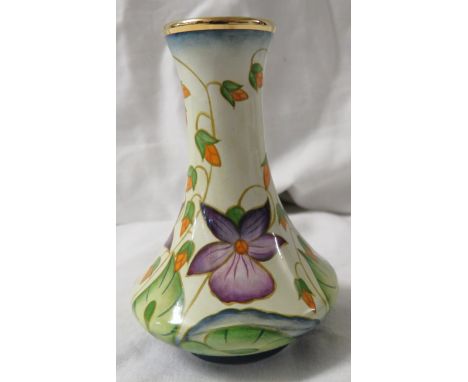 Moorcroft enamel baluster vase, cream ground, purple flowers and trailing red buds and green leaves, gilt rim, height 8cm, th