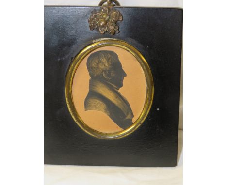 Painted oval portrait miniature of gentleman, head and shoulders enhance silhouette, signed to reverse Axla Davis (6.7cm x 5.