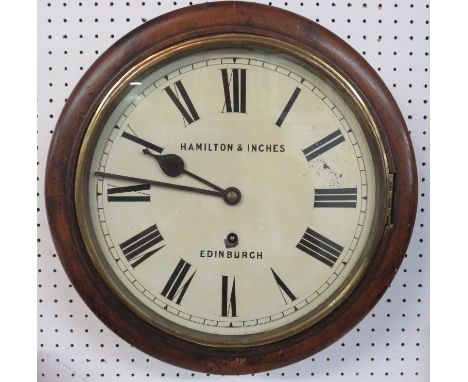 An oak framed circular Victorian wall clock with enamel dial and Roman chapter by Hamilton and Inches of Edinburgh, with a cl