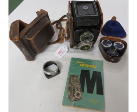 Minolta Autocard twin lens reflex camera No 364993 with Rokkor 75mm f3.5 taking lens, f3.2 viewing lens, leather case, instru