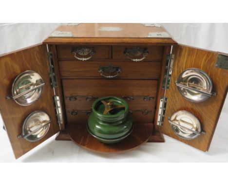 Oak smoker's cabinet with silver plated mounts, 1920 engraved presentation escutcheon, interior with three drawers lined with