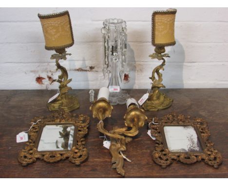 A pair of 19th century small and ornate wall mirrors, the glass 13cm x 9.5cm, gilt brass frames moulded and pierced as foliag