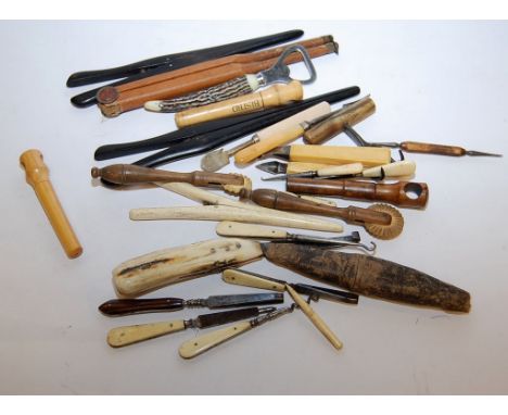 A COLLECTION OF BONE AND WOODEN HANDLED TOOLS, MANICURE ITEMS, BUTTON HOOKS, CUTTERS, CORK SCREWS, GLOVE STRETCHERS (APPROX 2