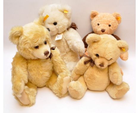 FOUR MODERN STEIFF TEDDY BEARS WITH BROWN ATTIRE ALL BEARING BUTTONS TO EAR 