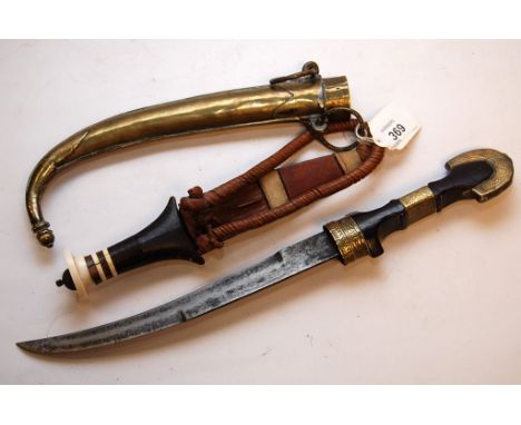 A TURKISH STYLE DAGGER WITH OAK HANDLE WITH BRASS MOUNTS AND SCABBARD AND SMALL AFRICAN TYPE DAGGER IN LEATHER SCABBARD 