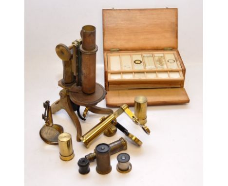VINTAGE BRASS MICROSCOPE TOGETHER WITH A CASED SET OF SLIDES 