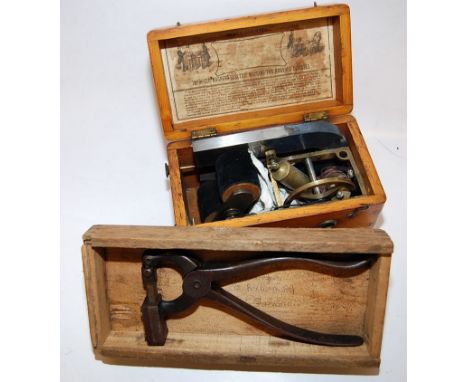 EARLY BOXED MEDICAL MACHINE "MAGNETO-ELECTRIC MACHINE" IN ORIGINAL BOX WITH LABEL ALONG WITH VINTAGE TAGGING TOOL (POSSIBLE A