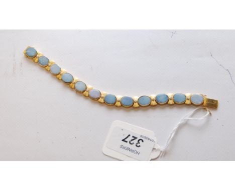 A BESPOKE YELLOW METAL AND DIAMOND OPAL BRACELET PURCHASED AS 18CT GOLD BUT NOT HALLMARKED 