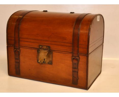 SATINWOOD DOMED TOP BOX IN THE FORM OF A TRAVELLING TRUNK THE INTERIOR FELT- LINED AND SEGMENTED INTO 4 COMPARTMENTS, 34 X 23